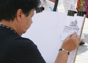 Sketching in Venice - A photo of a woman drawing in Venice, Italy
